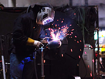 CCI welder working on a custom fabrication project